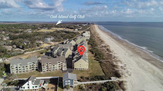 bird's eye view featuring a view of the beach and a water view