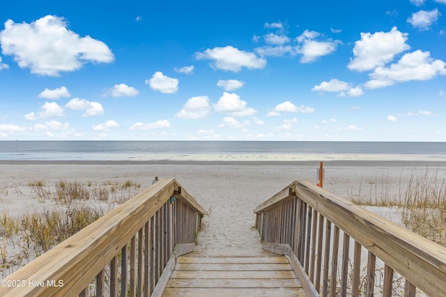 view of property's community with a view of the beach and a water view