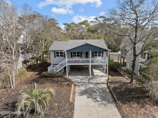 view of front of house with a carport and covered porch