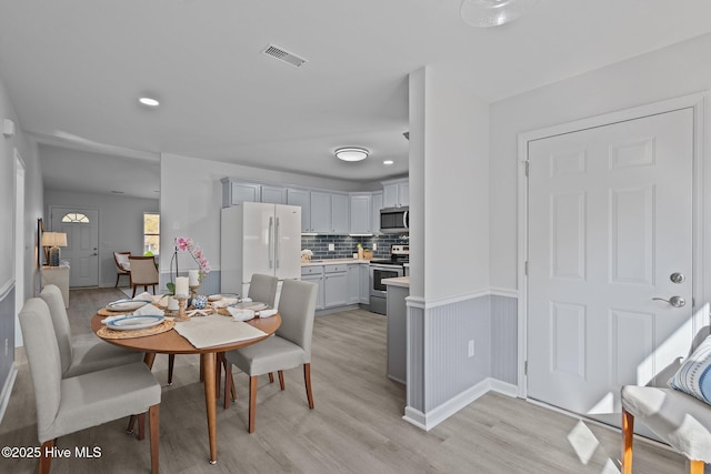 dining room with light wood-type flooring