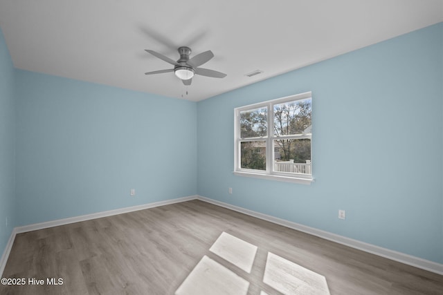 spare room with ceiling fan and light hardwood / wood-style flooring