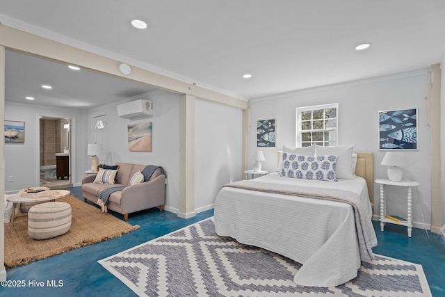 bedroom featuring ensuite bathroom and a wall mounted AC