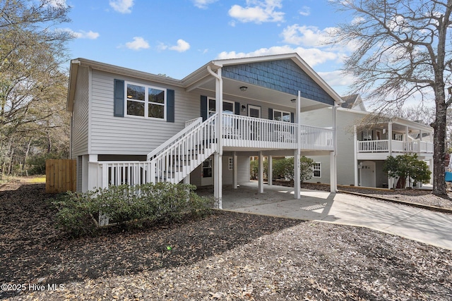 back of house featuring covered porch