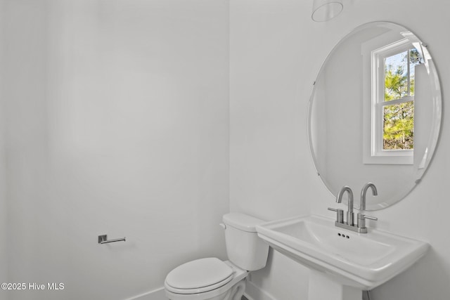 bathroom with toilet and sink