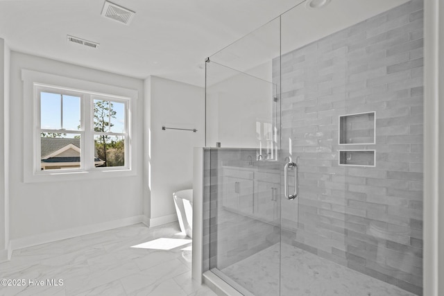 bathroom featuring separate shower and tub