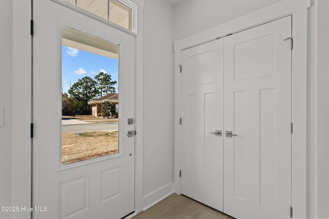 entryway with light hardwood / wood-style flooring