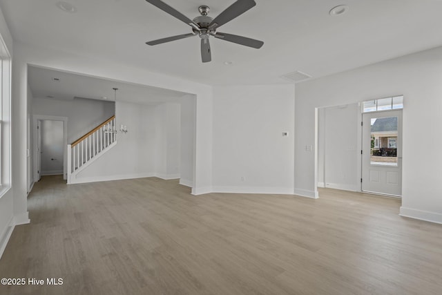 unfurnished living room featuring light hardwood / wood-style floors and ceiling fan