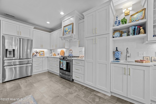 kitchen with white cabinetry, stainless steel appliances, and sink