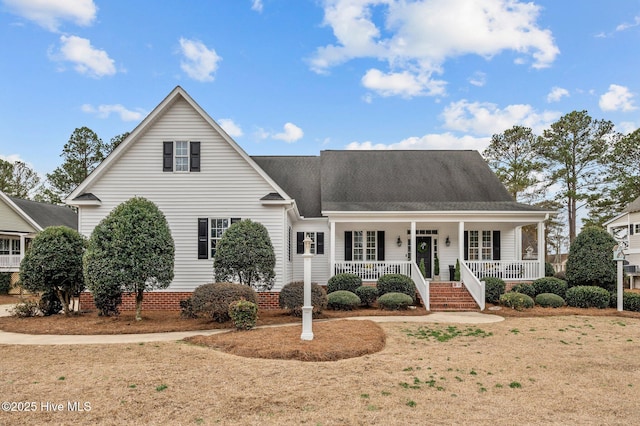 view of front of home with a porch and a front yard