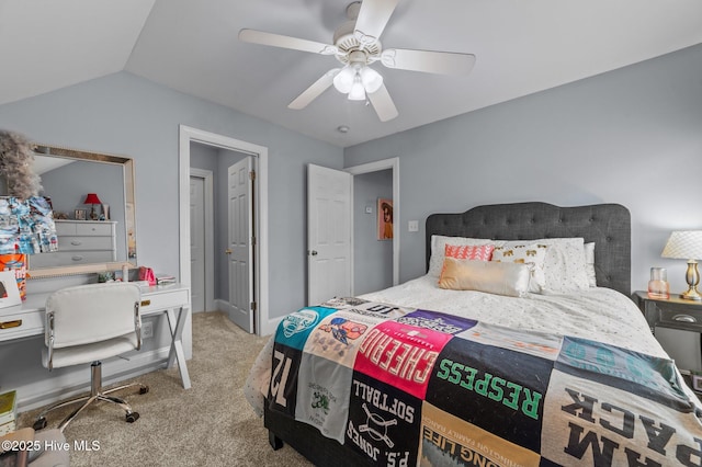 carpeted bedroom featuring lofted ceiling and ceiling fan