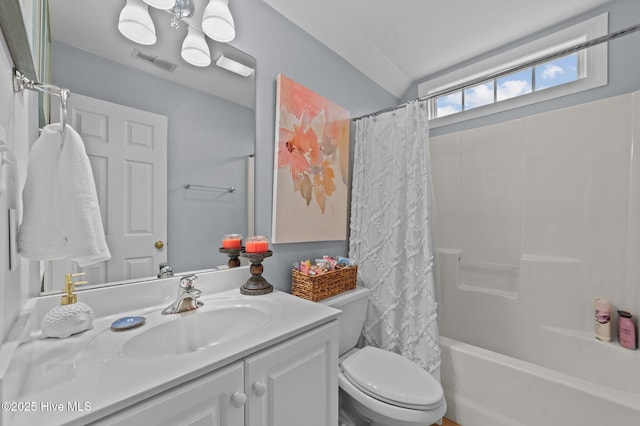 full bathroom featuring shower / tub combo with curtain, vanity, and toilet