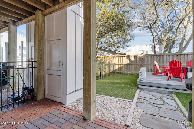 view of yard featuring a patio area and a deck