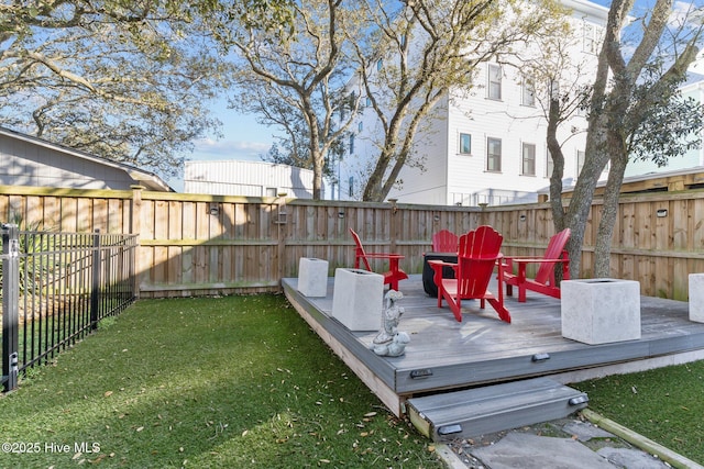 wooden terrace with a yard