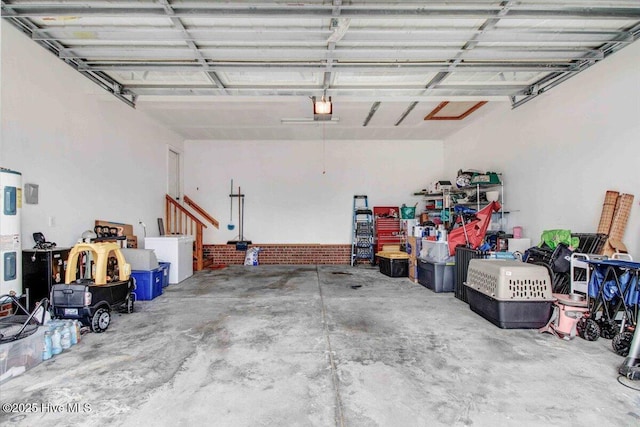 garage with a garage door opener and water heater