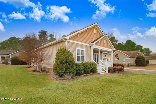 view of front of home with a front yard and a porch