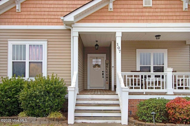 doorway to property with a porch