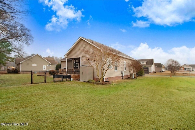 rear view of house with a yard