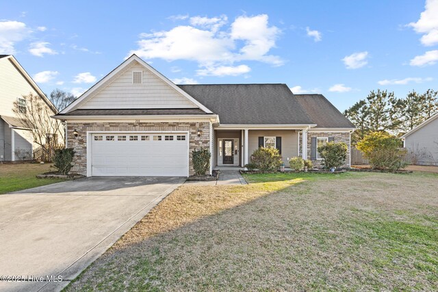 view of front of home with a garage and a front yard