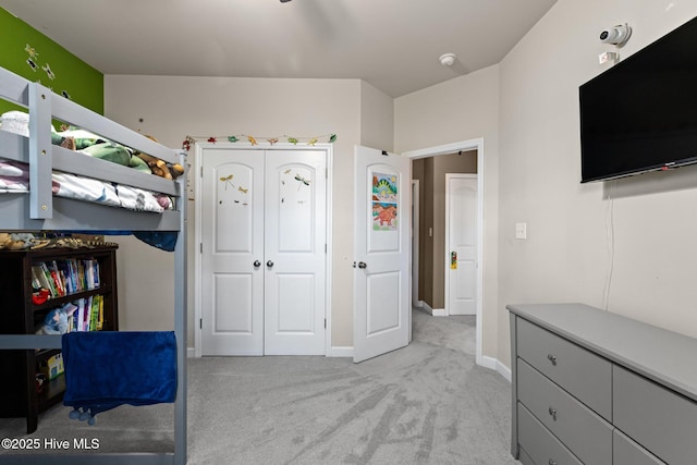 bedroom featuring light colored carpet