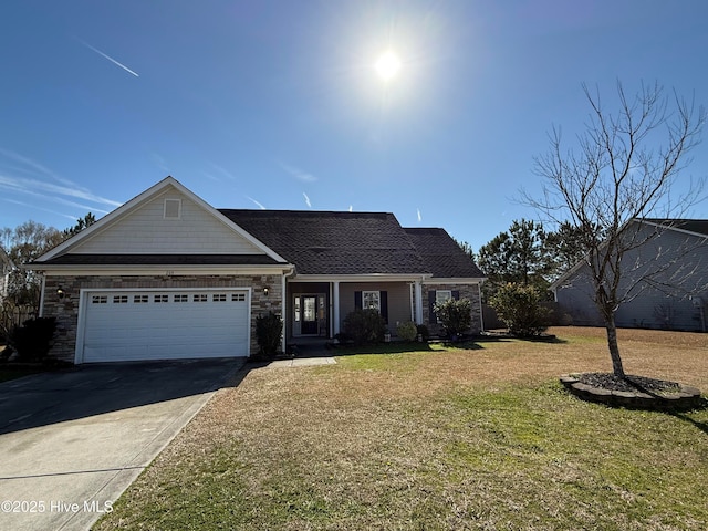 view of front of home featuring a garage and a front yard