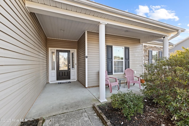 property entrance with covered porch