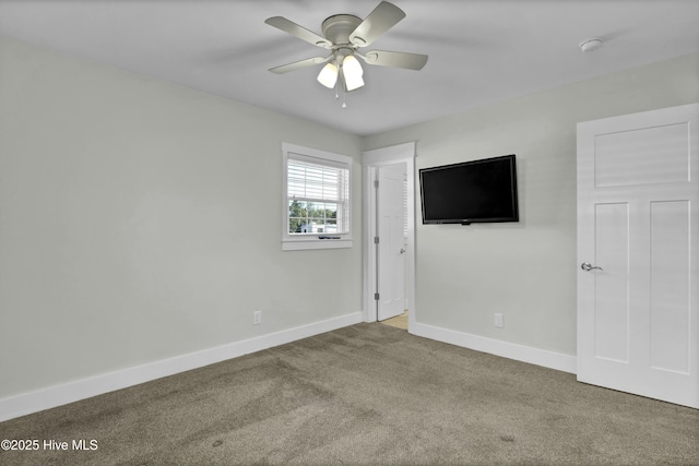 carpeted empty room with ceiling fan