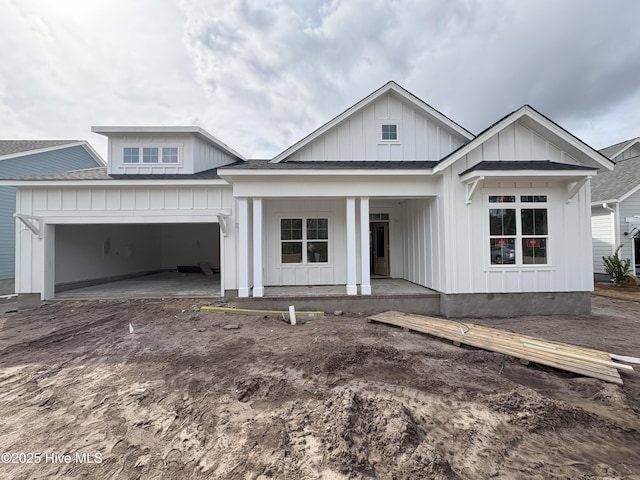 view of front of house featuring a garage and covered porch