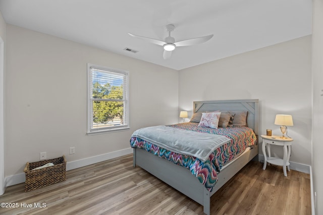 bedroom featuring hardwood / wood-style flooring and ceiling fan