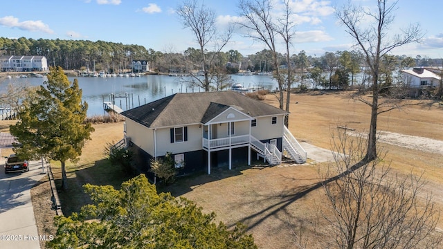 birds eye view of property with a water view