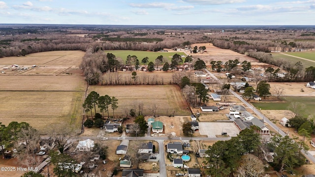 birds eye view of property with a rural view