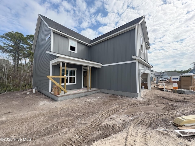 view of front of house featuring a garage and a porch