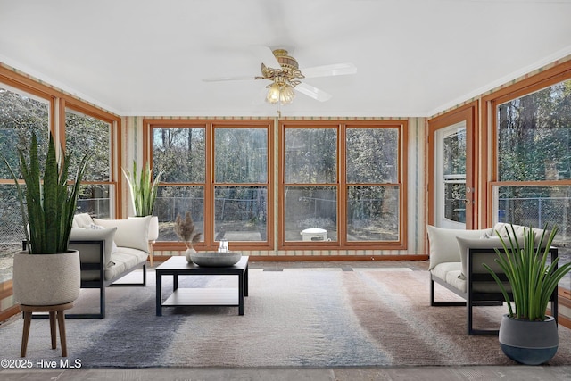 sunroom / solarium with ceiling fan