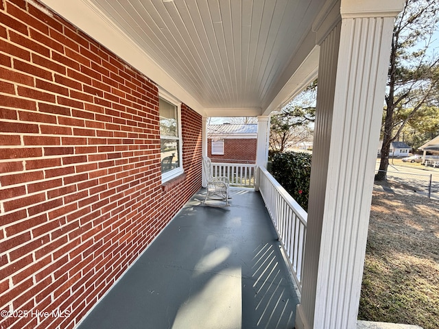 balcony featuring a porch