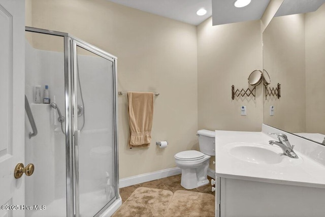 bathroom featuring toilet, vanity, tile patterned flooring, and an enclosed shower