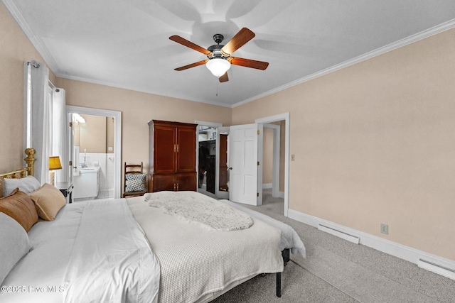 bedroom featuring ornamental molding, light colored carpet, ceiling fan, and ensuite bathroom