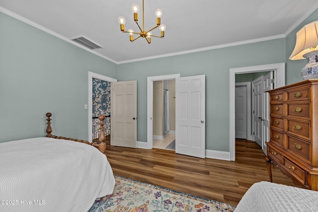 bedroom with crown molding, dark hardwood / wood-style floors, and a chandelier