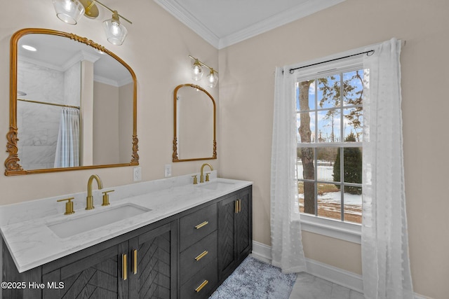 bathroom featuring ornamental molding, plenty of natural light, and vanity