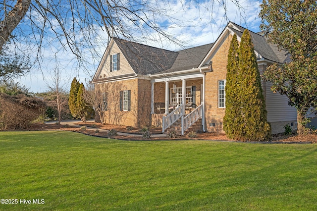 view of front of home with a sunroom and a front yard