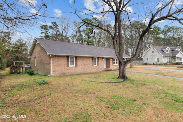 ranch-style home with a front yard