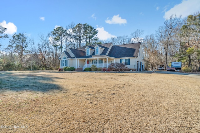 cape cod home with a porch and a front yard