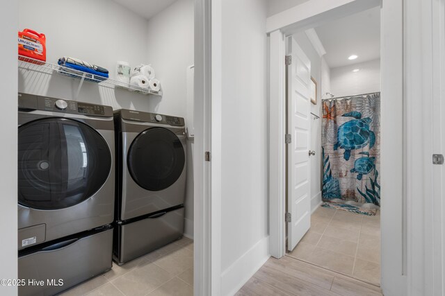 clothes washing area featuring light tile patterned floors, recessed lighting, laundry area, and independent washer and dryer