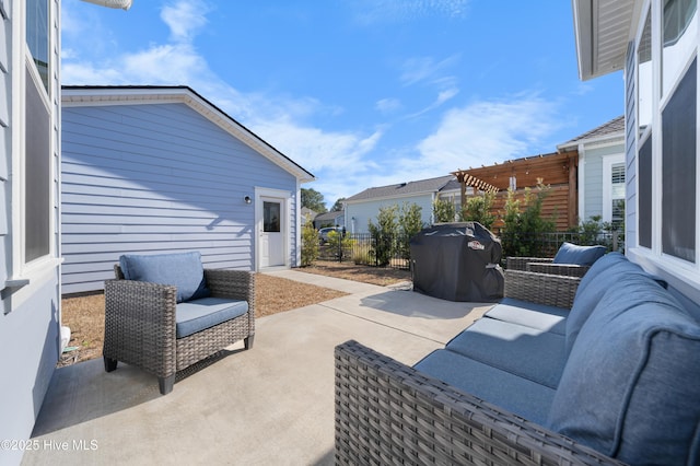 view of patio featuring grilling area, fence, an outdoor living space, and a pergola