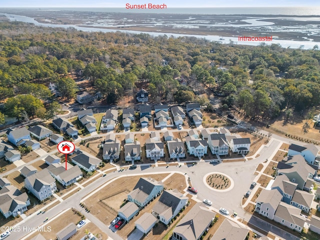 birds eye view of property with a residential view and a water view