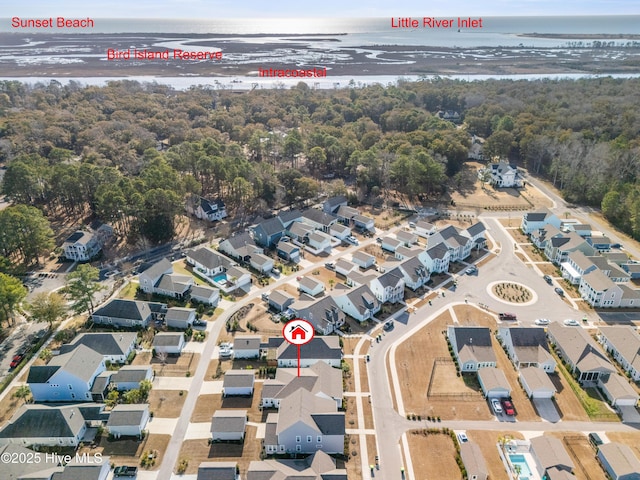 bird's eye view featuring a water view and a residential view