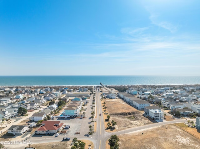 drone / aerial view featuring a water view and a residential view