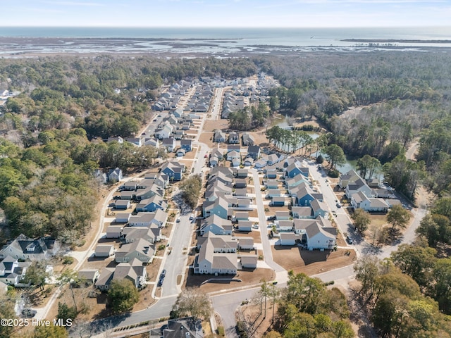 birds eye view of property with a residential view and a water view