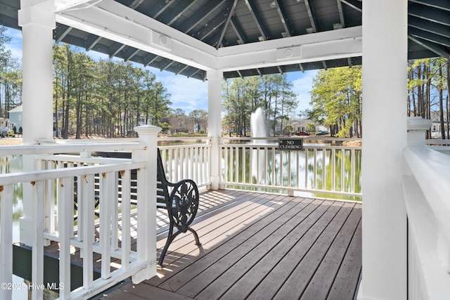 wooden terrace with a gazebo and a water view