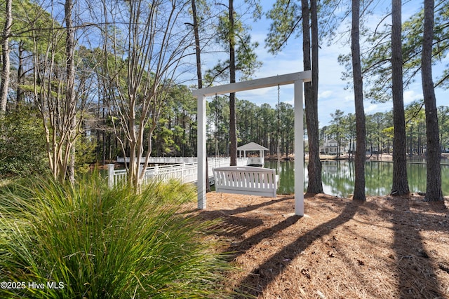 view of yard featuring a gazebo and a water view