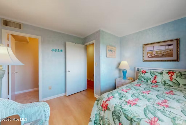 bedroom featuring light hardwood / wood-style floors