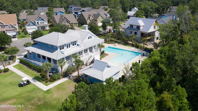birds eye view of property with a residential view
